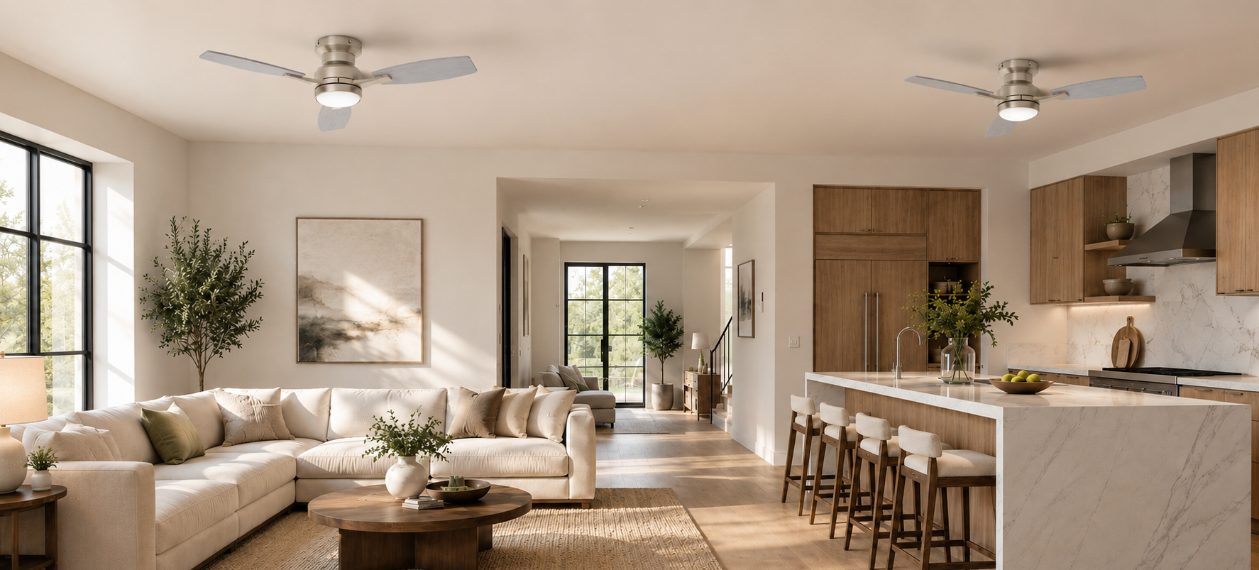 Two brushed nickel flush mount ceiling fans with lights in an open-plan living room and kitchen