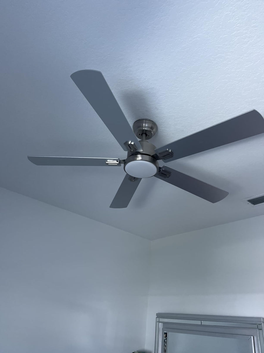Customer-installed Warmiplanet 52 inch brushed nickel ceiling fan in a bright room