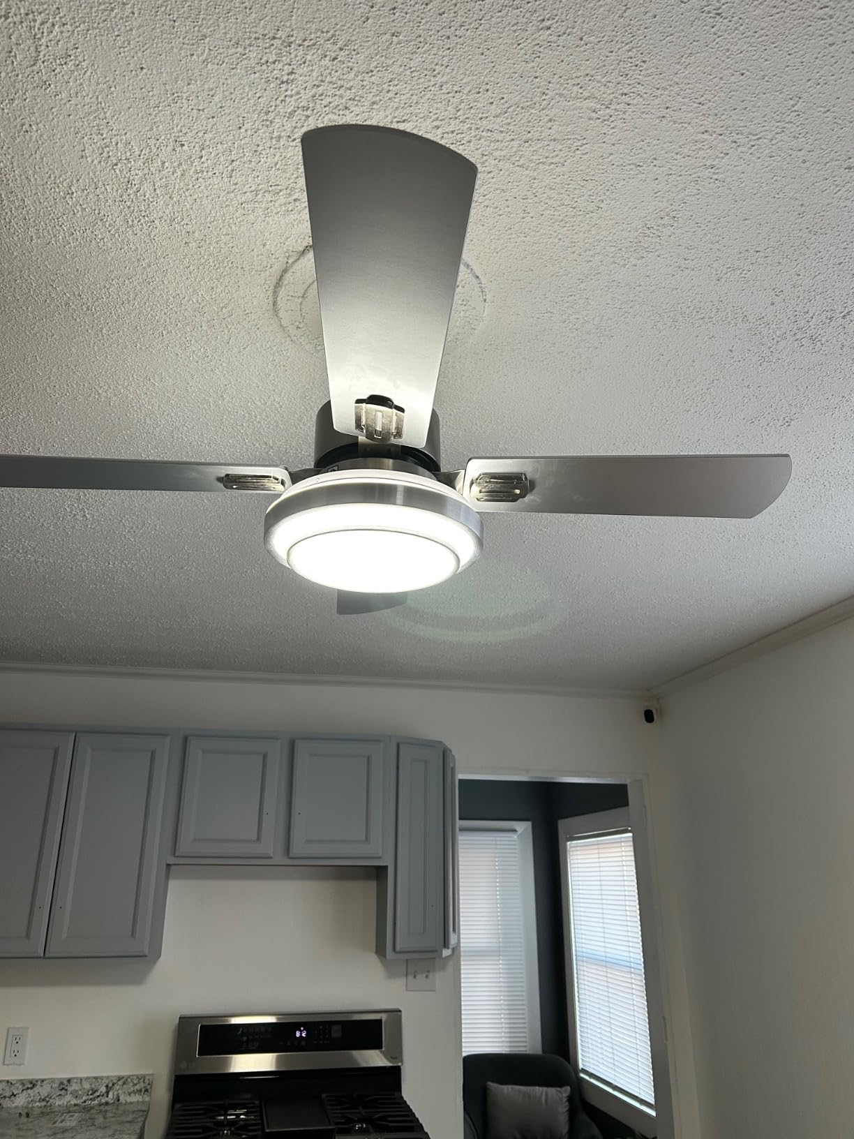 Warmiplanet brushed nickel ceiling fan installed in Teresa E Hough kitchen